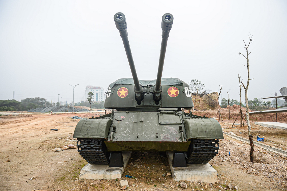Panoramic view of outdoor display at Vietnam Military History Museum featuring tanks, artillery, and warplanes from the Vietnam War era